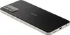 A close-up, angled view of the back of a black Nokia smartphone with a silver frame, resting on a white surface. Podgląd zdjęcia produktu
