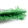 A close-up, side view of green shredded paper, likely used as piñata filler or gift packaging. Produktbild-Vorschau