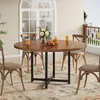 A round dining table with chairs set up on a patio or balcony, with a view of a house and railing in the background. Produktbild-Vorschau