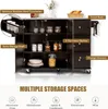 A dark brown kitchen island with a stainless steel countertop, shown with its doors and drawers open to reveal storage spaces. Various kitchen items are displayed inside. Náhľad obrázku produktu