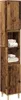 A tall, narrow wooden cabinet with shelves and doors, filled with folded white towels. Náhled obrázku produktu