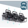 A black metal shower caddy holding three kettlebells, mounted on a white wall. Blue arrows indicate airflow. Náhled obrázku produktu