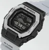 A close-up, angled shot of a Casio G-Shock G-Lide watch with a black case, silver bezel, and white strap. Podgląd zdjęcia produktu