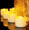 A group of LED tea lights with warm white light are arranged on a reflective surface, with a blurred golden background. Produktbild-Vorschau