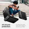 A young man sits on stairs using a smartphone with a protective case. Produktbild-Vorschau