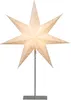A white, star-shaped paper lamp with small perforations, illuminated from within, standing on a silver metal stand. Produktbild-Vorschau