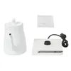 A white electric kettle, its base, and an instruction manual are laid out on a white background. Náhled obrázku produktu