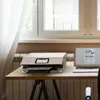 A printer and laptop are set up on a desk next to a window with sheer curtains. Podgląd zdjęcia produktu