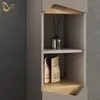 A close-up of a modern bathroom cabinet with shelves displaying decorative items and packaging. Anteprima dell’immagine prodotto