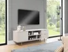 A modern TV stand with a television mounted above it, in a well-lit living room with a large window overlooking a garden. Produktbild-Vorschau