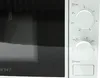 A close-up view of the control panel of a white microwave oven. Produktbild-Vorschau