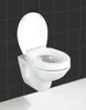 A white toilet seat is mounted on a wall against a black tiled background and a white tiled floor. Produktbild-Vorschau
