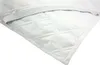 A close-up view of a white quilted mattress protector with an elastic band. Produktbild-Vorschau