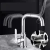 A chrome kitchen faucet is shown on a marble countertop with a dark background. The faucet is depicted with a transparent overlay showing its flexible hose and multiple positions. Produktbild-Vorschau