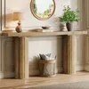 A console table with a lamp, books, and a plant, set against a wall with decorative molding. Produktbild-Vorschau