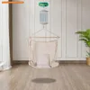 A baby swing motor unit is shown hanging from the ceiling, with a hammock-like swing suspended below it. Produktbild-Vorschau