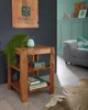 A wooden side table with decorative items and books in a living room setting. Podgląd zdjęcia produktu