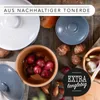 A collection of terracotta pots and vegetables arranged on a wooden surface. Produktbild-Vorschau