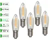 Five LED filament bulbs with clear ribbed glass shades and silver bases are arranged on a white background. To the left of the bulbs, there are several green rectangular boxes containing text and icons that describe the product's specifications. Produktbild-Vorschau