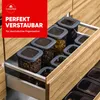 A drawer in a kitchen cabinet is pulled open, revealing several clear plastic food storage containers with gray lids, filled with various dry goods like pasta and cereal. Náhľad obrázku produktu