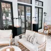 An outdoor patio area with modern furniture and gas fireplaces. Podgląd zdjęcia produktu