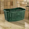 A green laundry basket sits on a speckled countertop in front of a tiled backsplash. Voir les images du produit