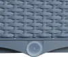 A close-up view of the woven texture of a gray rattan-look product, with a small transparent cap visible at the bottom. Produktbild-Vorschau