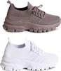 Two pairs of sneakers, one brown and one white, displayed side-by-side against a white background.