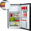 An open mini-refrigerator stocked with various food and drink items. Voir les images du produit