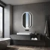 A modern bathroom with a vanity, sink, and illuminated mirror. Anteprima dell’immagine prodotto