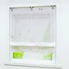 A white Roman blind with a silver triangle pattern is shown hanging in a window. Produktbild-Vorschau