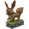 A brown Eevee Pokemon figure made of building blocks, standing on a gray base with green grass. Náhľad obrázku produktu