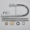 A kitchen faucet and its accessories are laid out on a white background. Náhled obrázku produktu