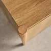 A close-up view of the corner of a wooden sideboard. Produktbild-Vorschau