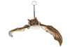 A plush toy bat hanging from a string against a white background. Voir les images du produit