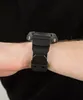 A close-up shot of a black watch on a person's wrist. Náhled obrázku produktu