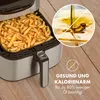 An air fryer filled with french fries, with a circular graphic showing oil being poured and text in German. Produktbild-Vorschau
