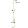 A gold-colored shower set with a rain shower head and a handheld shower head, displayed against a white background. Anteprima dell’immagine prodotto