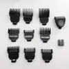 A collection of black hair clipper attachments and a trimmer head are laid out on a white background. Produktbild-Vorschau