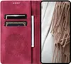 A red flip case for a Samsung Galaxy A56 phone is shown open, revealing card slots and a mandala design. A beige scarf is visible on the right side of the image. Produktbild-Vorschau