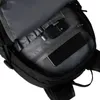 Close-up view of the inside of a black backpack, showing organized compartments and electronic devices. Produktbild-Vorschau
