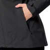 A close-up shot of a person's hand reaching into the pocket of a black jacket. Náhľad obrázku produktu