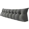 A long, tufted wedge pillow on a white background. Produktbild-Vorschau