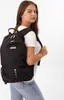 A young woman wearing a backpack. Produktbild-Vorschau