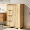 A wooden cabinet with drawers and a door in a bathroom setting. Náhled obrázku produktu