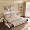 A bedroom scene featuring a bed with storage, bedside tables, and wall art. Produktbild-Vorschau