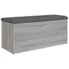 A storage bench with a gray upholstered top and a wood-effect base, shown against a white background. Náhled obrázku produktu