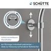 Close-up of a shower head holder on a wall, with a diagram showing its adjustable width. Podgląd zdjęcia produktu