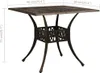 A square bronze garden table with decorative legs and a patterned tabletop, shown against a white background with dimensions indicated. Náhľad obrázku produktu