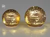 Two illuminated decorative glass spheres with a winter mountain and deer motif. Produktbild-Vorschau